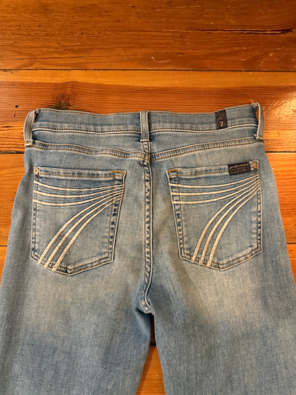 7 For All Mankind Light Blue Bootcut Jeans with Curved Pocket Stitching